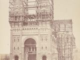 an old photo of a large building under construction