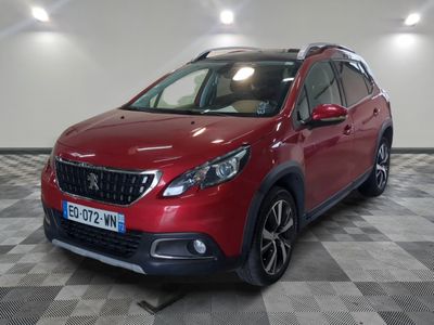 a red suv parked in a garage with a checkered floor