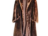 brown faux coat with fur collar and cuffs on a hanger
