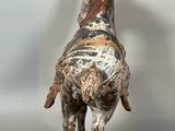 statue of a horse on a wooden base on a white background