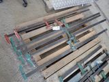 a pile of pallets sitting on the ground next to each other
