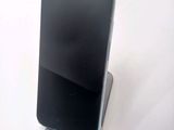 a cell phone that is sitting on top of a stand