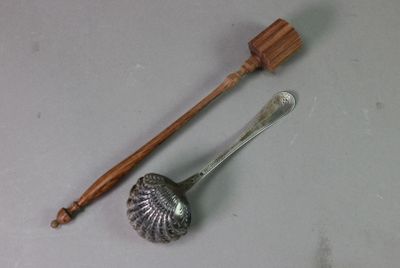 a spoon with a wooden handle next to a spoon with a wooden handle