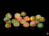 some white and green fire oplites on a black surface