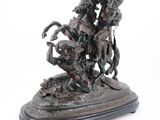 bronze statue of a man on a horse with a woman on a horse