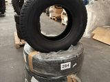 tires are stacked on pallets in a warehouse with pallets of pallets