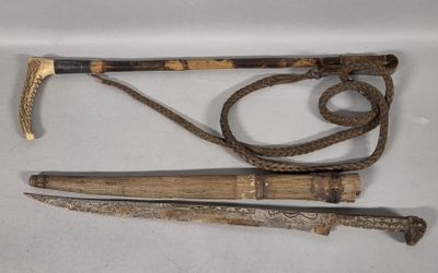 two different types of walking sticks and a cane on a white surface
