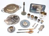 a lot of silver items that are on the table