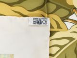 a close up of a piece of fabric with a picture of a giraffe on it