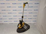 yellow and black metal detector sitting on top of a black bag