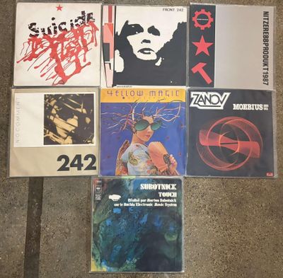 various cd ' s and cassette ' s sitting on the floor
