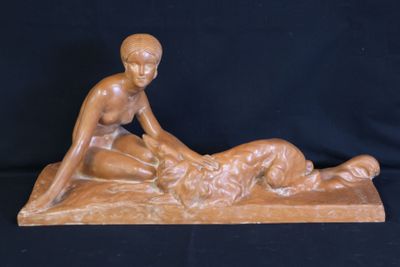 sculpture of a woman laying on a man ' s back