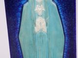 a picture of a statue of the virgin mary on a blue background