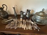 a table with silverware and silverware on it
