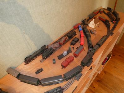 a lot of toy trains on a table in a room