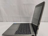 an open laptop computer sitting on top of a white surface