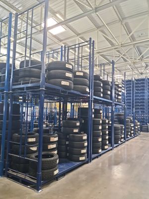 a lot of tires on the shelves in the warehouse