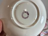 a person holding a white plate with a picture of a horse on it