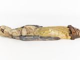 statue of a man laying on a body with a knife in his hand