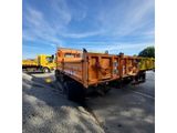 an image of a dump truck parked in a parking lot