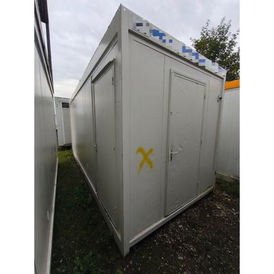une image représentant un conteneur de stockage blanc recouvert de graffitis