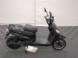 a scooter that is parked on a checkered floor