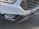 a close up of the front of a white car
