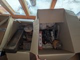 a person that is holding a box full of stuff