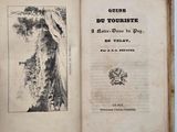 an open book with a drawing of a tree on it