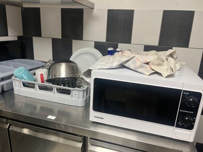 a microwave sitting on top of a counter in a kitchen