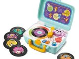 une image représentant une valise jouet avec un tourne-disque et des autocollants