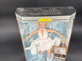 doll in a box with a picture of a woman sitting on a toilet