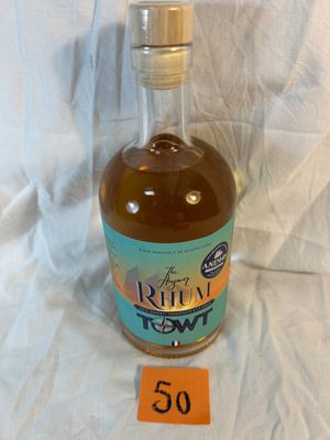 a bottle of liquor sitting on a table with a price tag