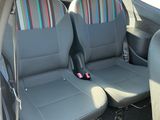 four seats in the back of a car that are empty