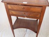 an old wooden table with a drawer on top of it