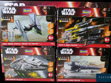 four star wars action figures on display in a store