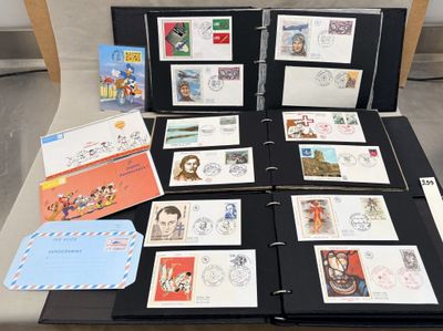 a lot of different stamps on a binder on a table