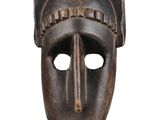 an image of a wooden mask with a cat ' s head on it