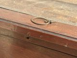 a wooden box with a handle on top of it