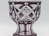 purple glass vase with a diamond design on the base
