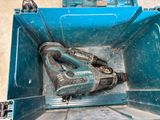 a blue tool box with a hammer inside of it