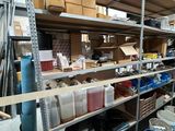 many shelves with various items on them in a room