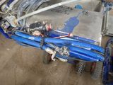 a blue motorcycle that is parked in a garage