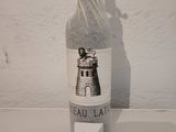 a bottle of wine that is sitting on a table