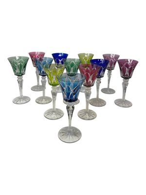a lot of wine glasses that are sitting on the table