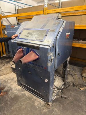a man that is standing next to a machine