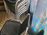 three chairs sitting next to each other on a tiled floor