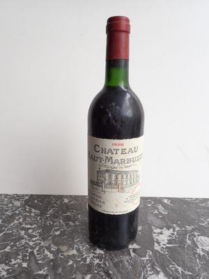 a bottle of wine that is sitting on a table