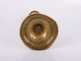 an image of a gold vase sitting on top of a white surface