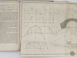 an open book with a drawing of a man ' s face on it